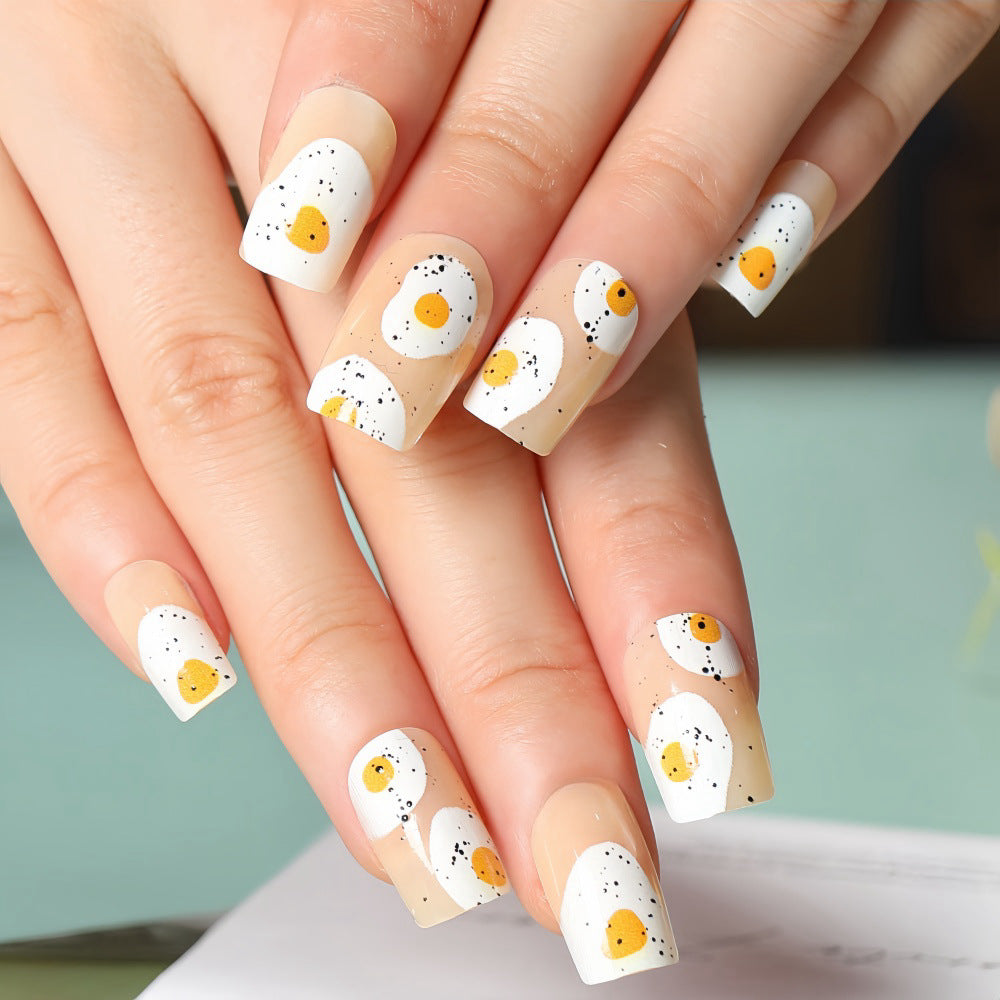 Artificial nails in creative fried egg design Bowlift
