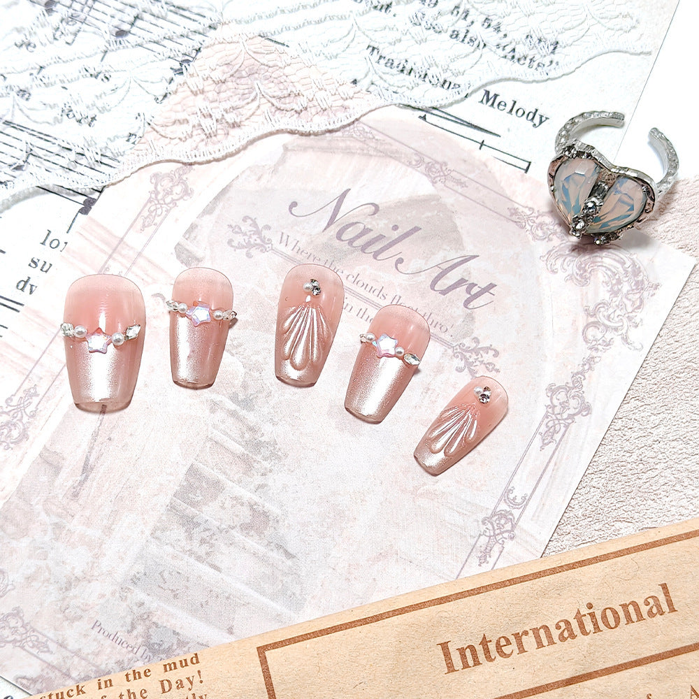Elegant artificial nails with pearl and rhinestone embellishments Bowlift