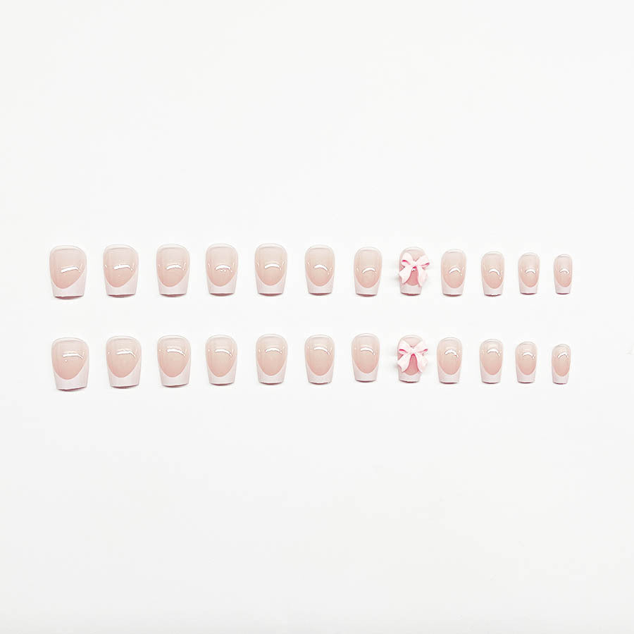 Decorative French Tip Nail Extensions with Bow Accents Bowlift