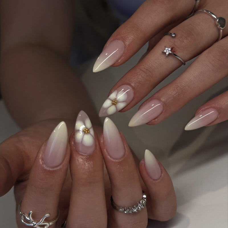 Elegant Stiletto Nails with Floral Accents Bowlift