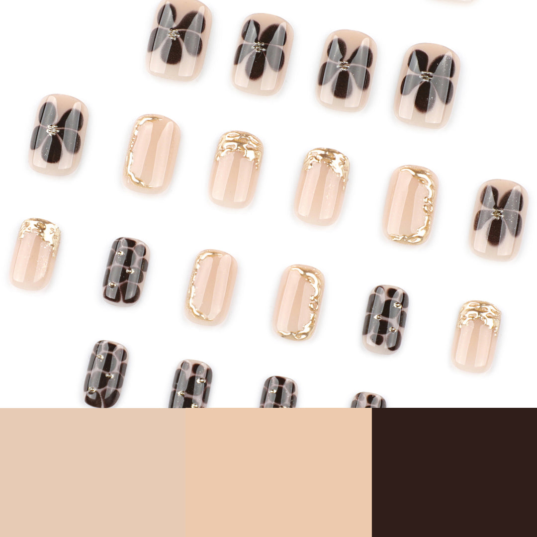 Artistic Nail Art with Elegant Golden Accents Bowlift