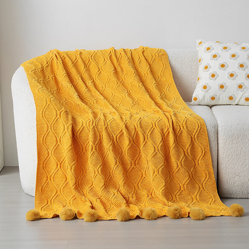Ladies knit blanket with decorative pom poms Bowlift
