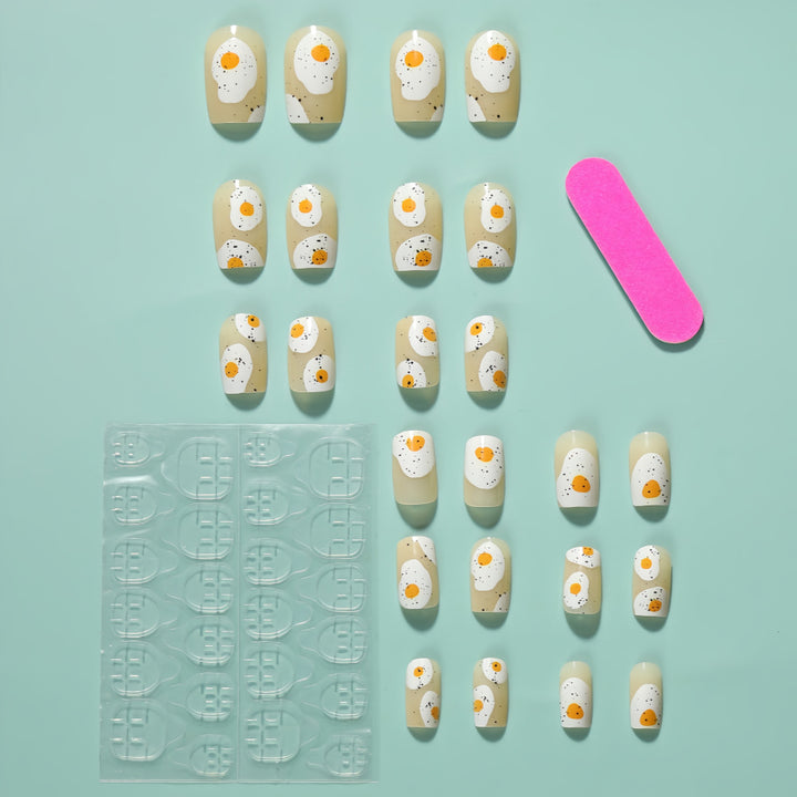 Artificial nails in creative fried egg design Bowlift