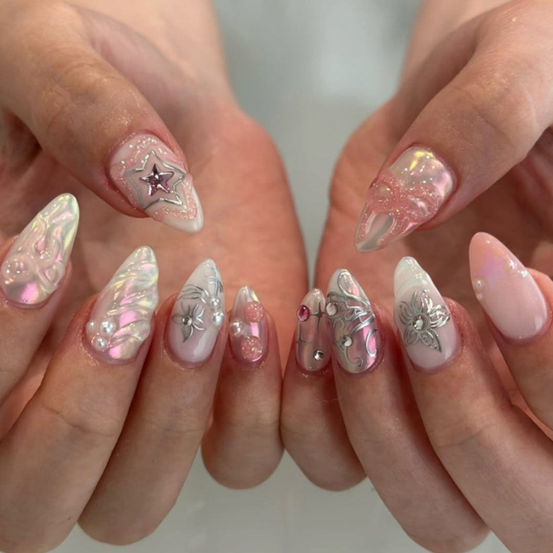 Artistic nail extensions with shiny embellishments Bowlift
