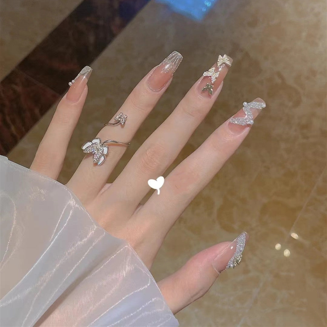 Trendy 3D design artificial nails with glitter and butterfly accents Bowlift