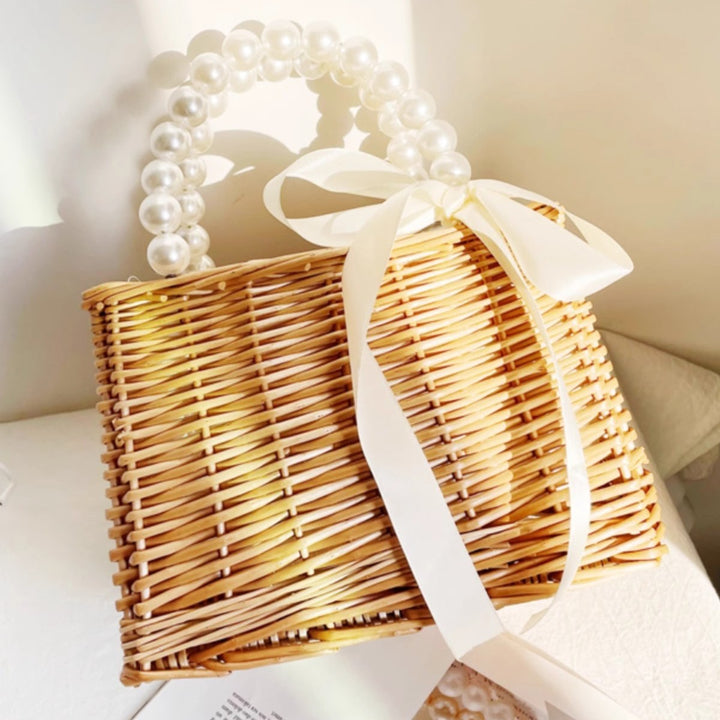 Ladies handbag made of braided material with elegant pearl handles Bowlift
