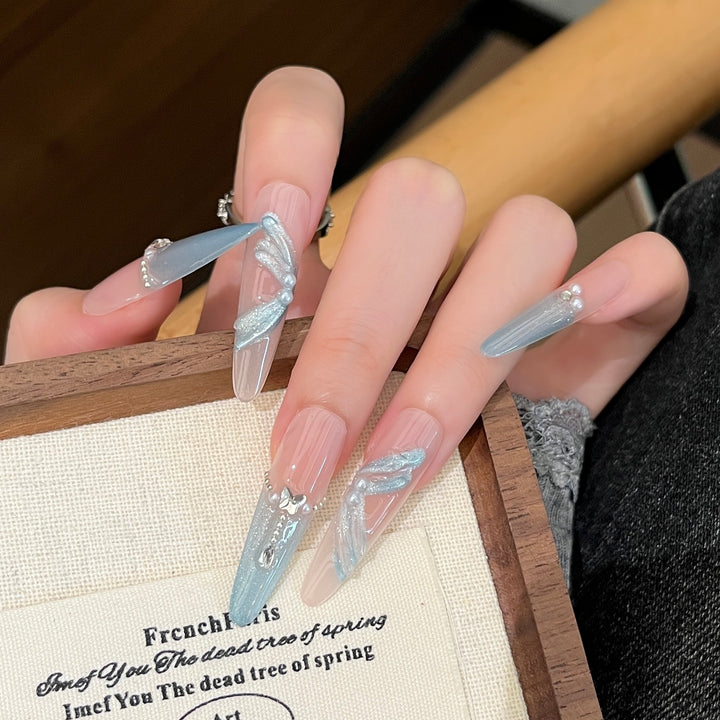 Artistic Stiletto Press-On Nail Art with Glimmering Accents Bowlift