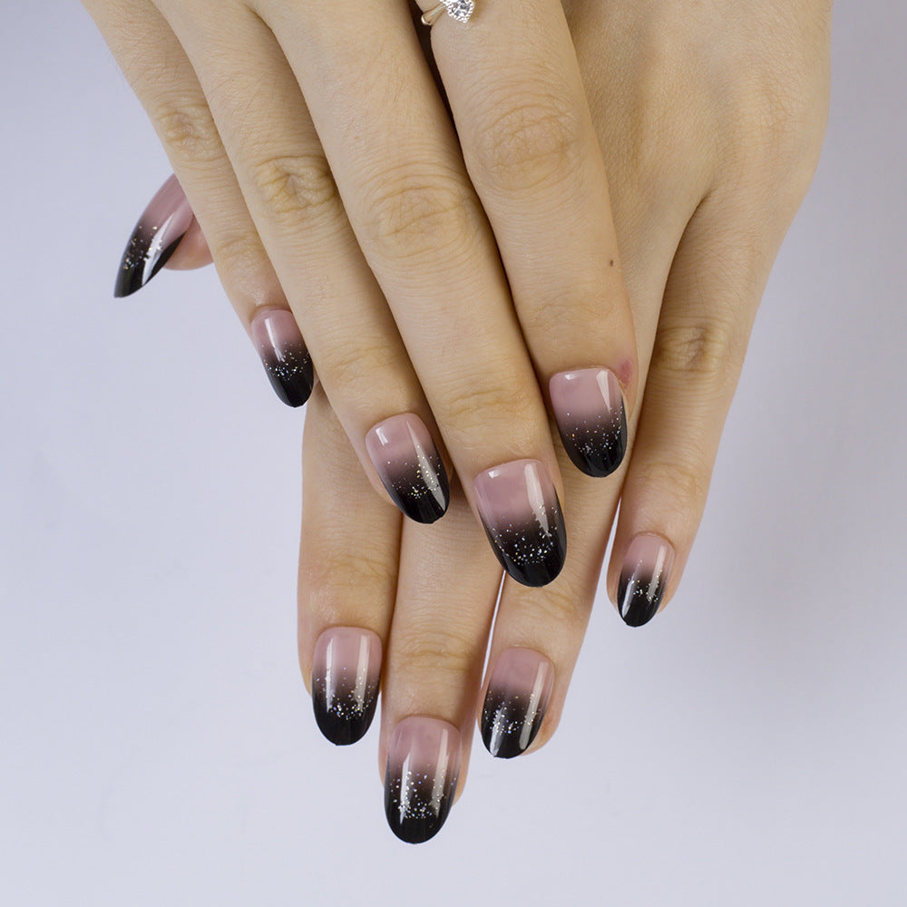 Elegant artificial nails in modern ombre style with glitter accents Bowlift