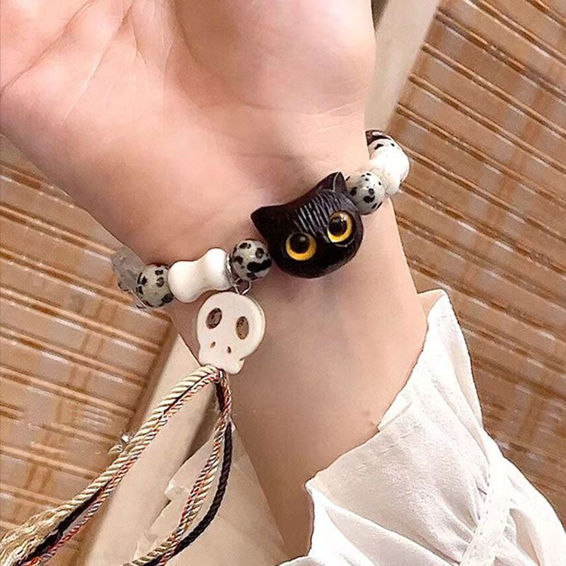 Whimsical Cat and Bone Charm Bracelet Bowlift