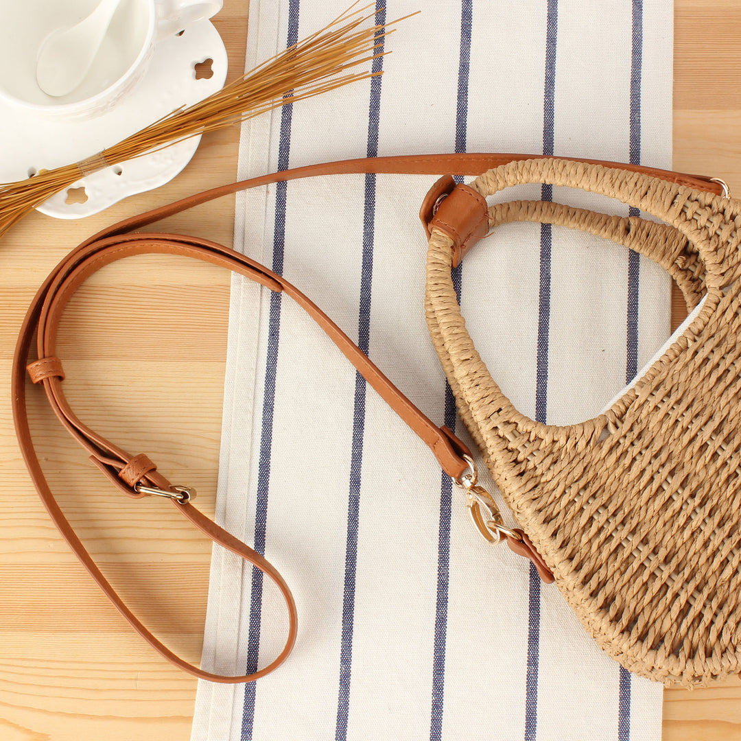 Shoulder bag made of woven natural material with elegant leather accent Bowlift