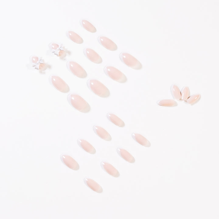 Elegant artificial nails with translucent French tip and decorative floral accents Bowlift