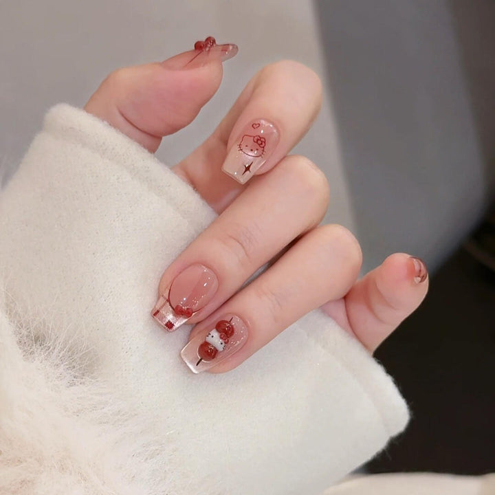 Artificial nails with playful Hello Kitty design Bowlift