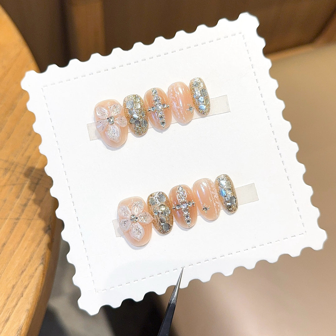 Glamorous artificial nails with floral and glittering accents Bowlift