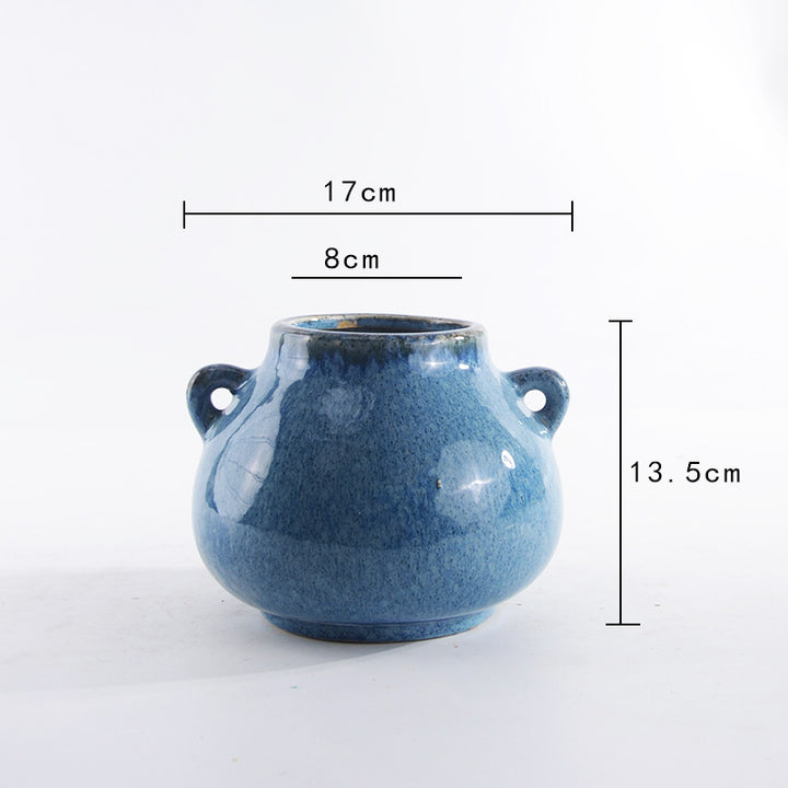 Decorative ceramic pot with playful handles Bowlift