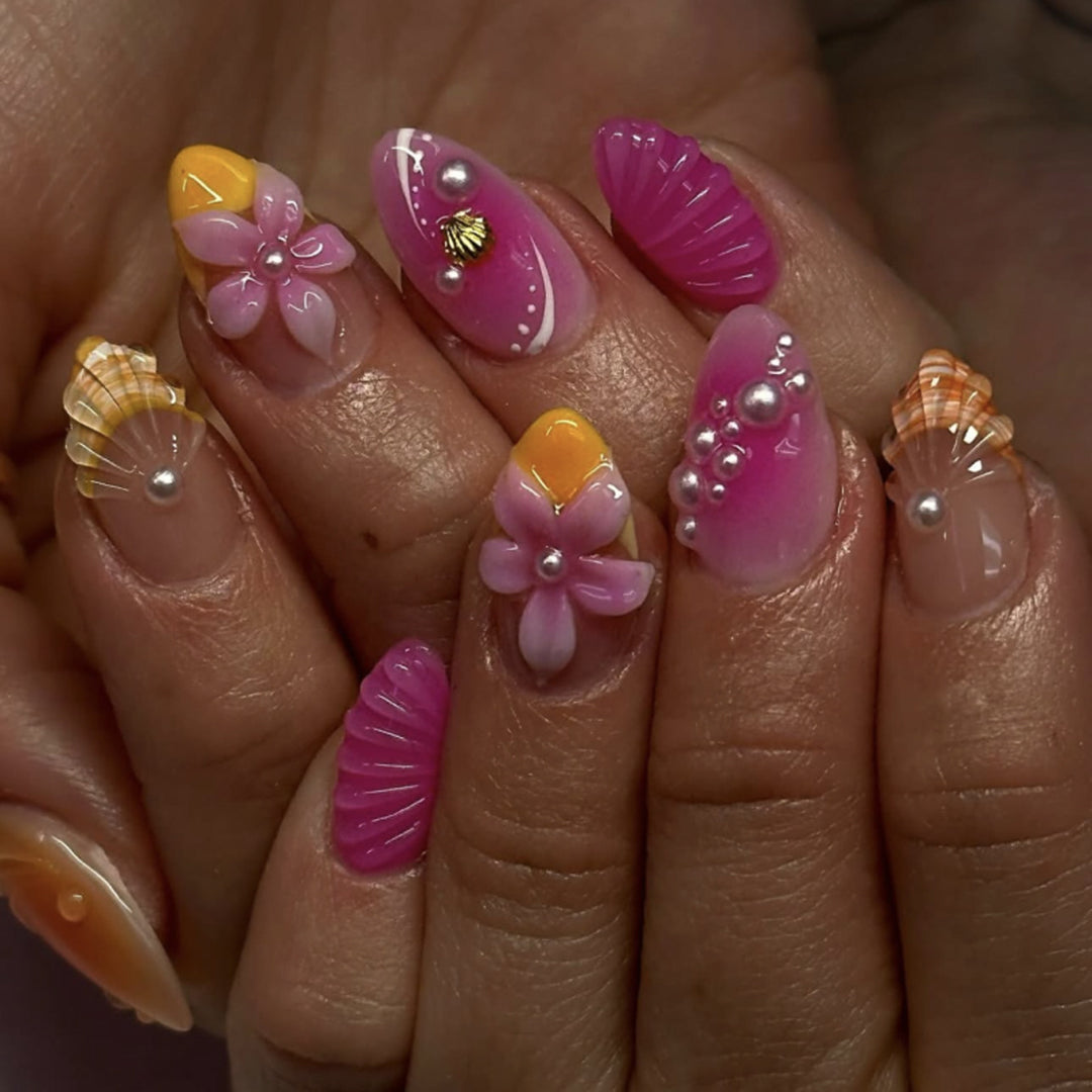 Artful nail extensions with floral and pearl-embellished accents Bowlift