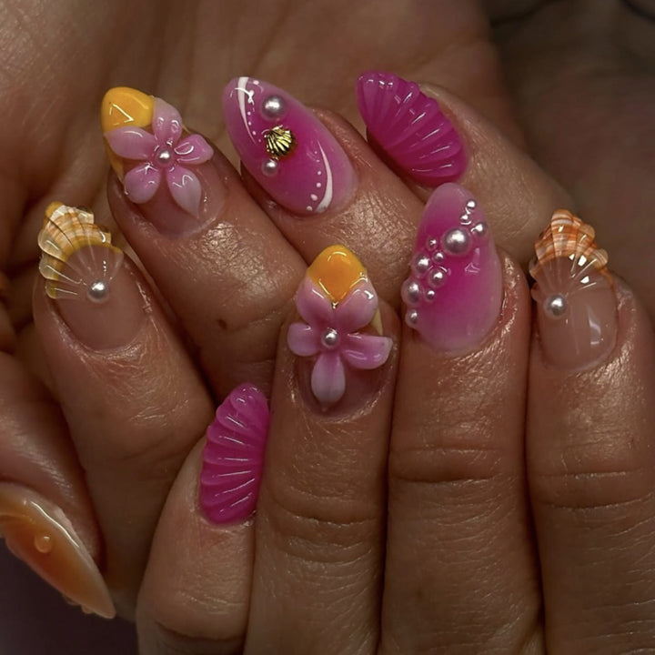 Artful nail extensions with floral and pearl-embellished accents Bowlift