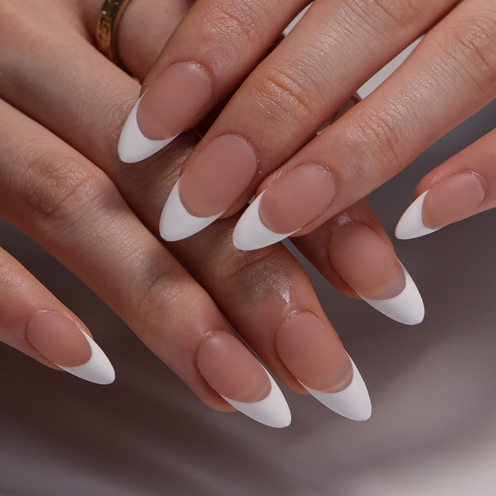 Artistic stiletto nails with elegant French design Bowlift