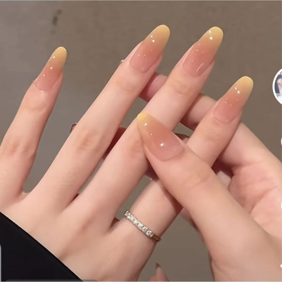 Artificial nails with elegant ombre effect and glitter coating Bowlift