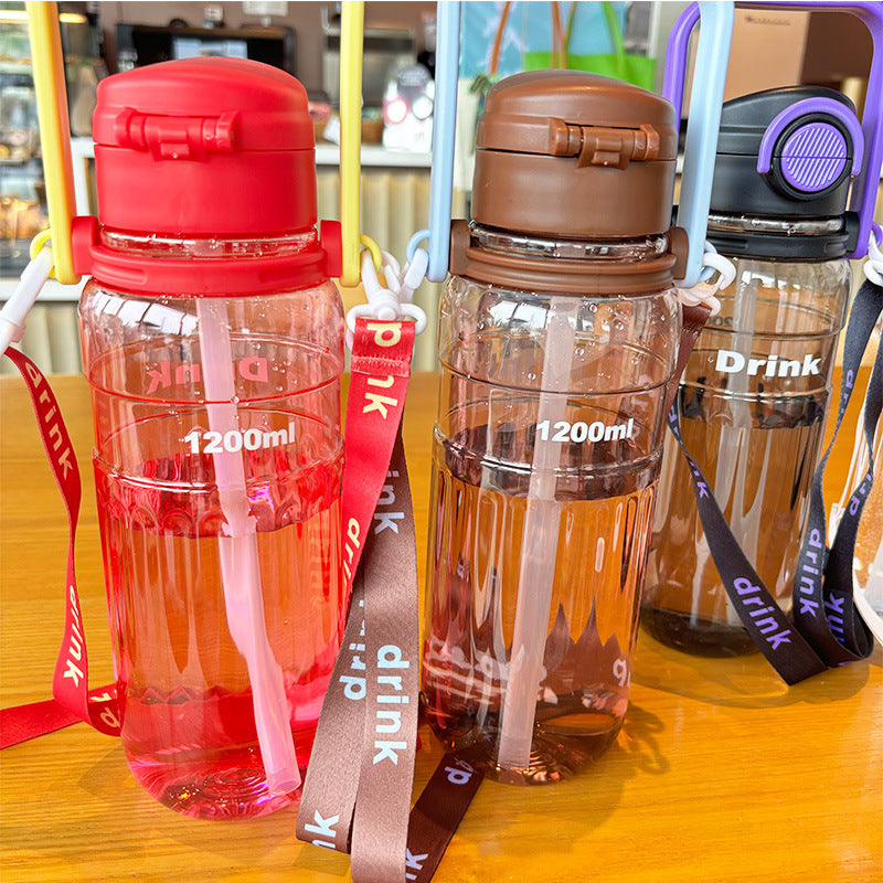 Women's large transparent drinking bottle with integrated carrying handle Bowlift