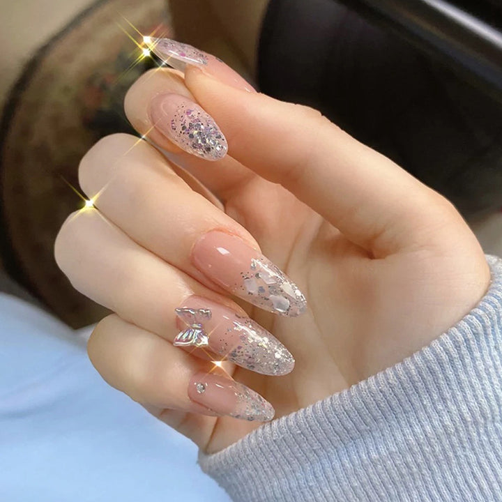 Glittering stiletto nails with elegant decorations Bowlift