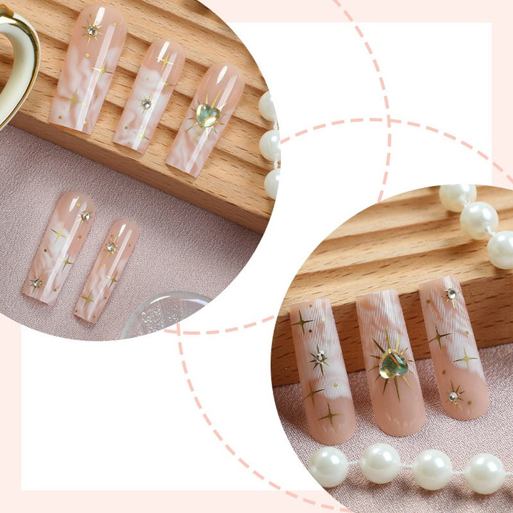 Nail set with glamorous gold decorations Bowlift