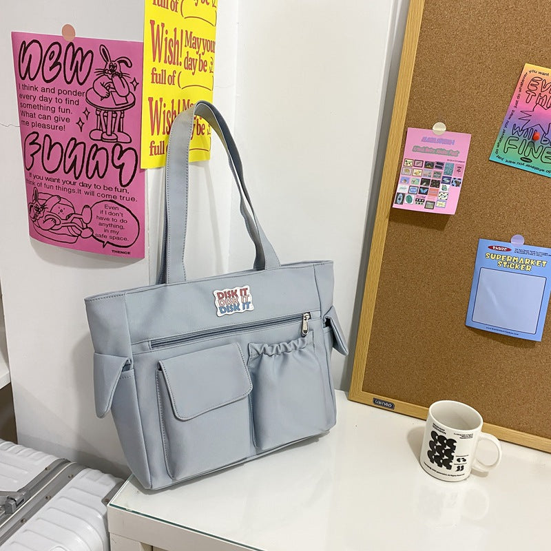 Tote bag with versatile compartments and ergonomic design Bowlift