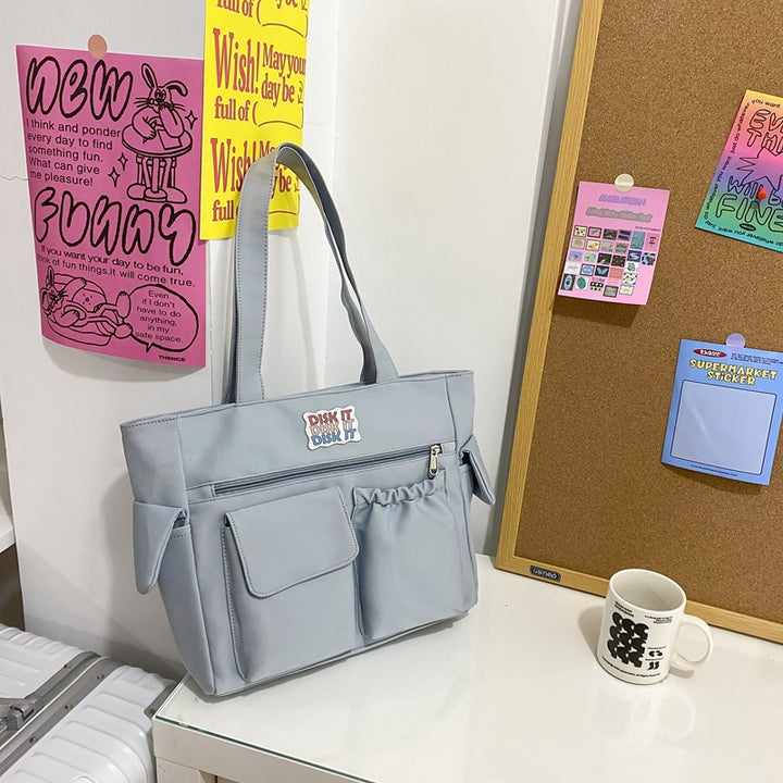 Tote bag with versatile compartments and ergonomic design Bowlift