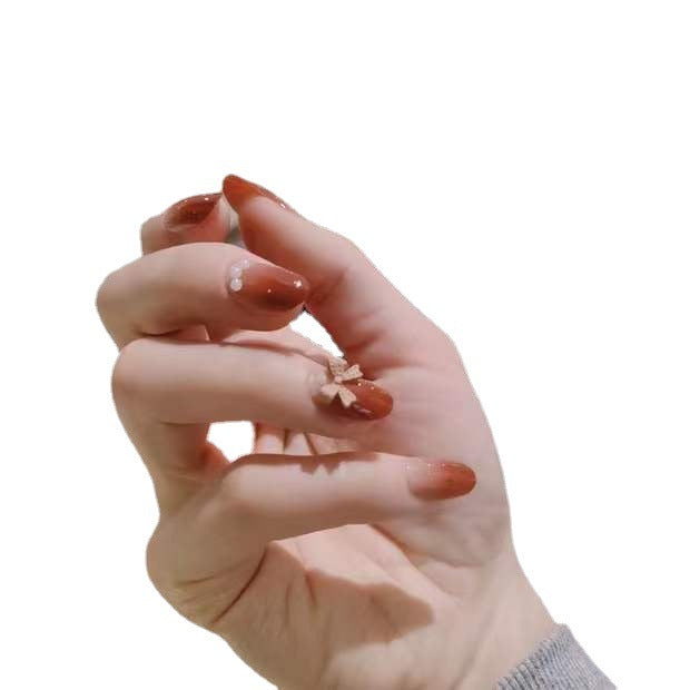 Artificial nails with glamorous bow and pearl decor Bowlift