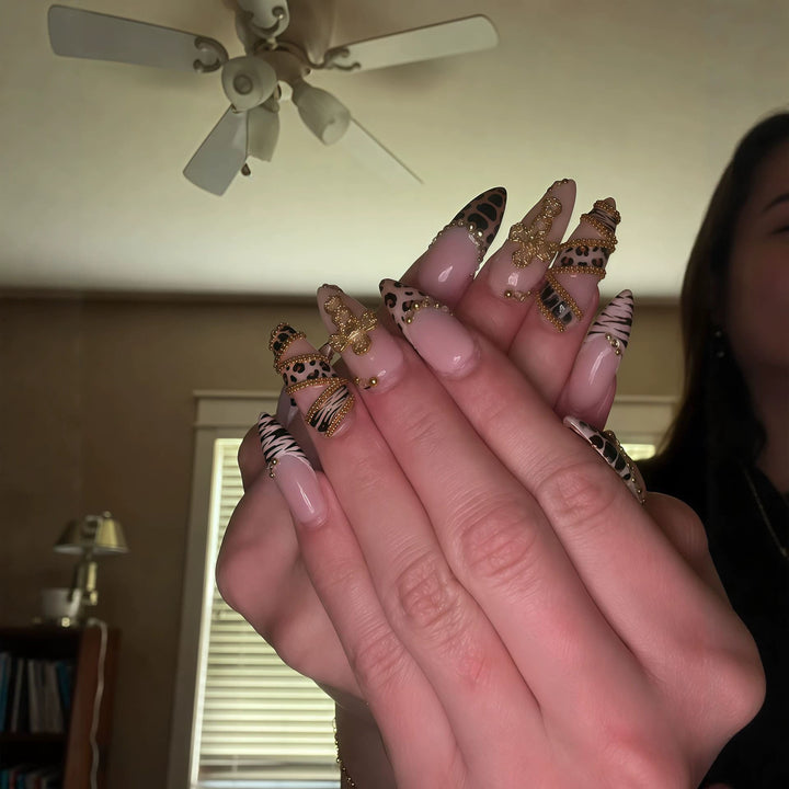 Artistic Stiletto Nail Enhancements with 3D Accents Bowlift