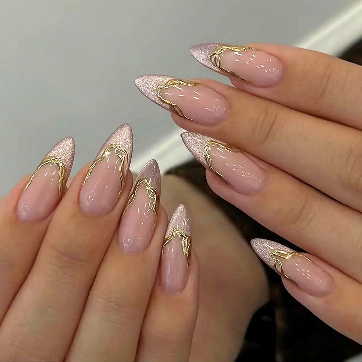 Acrylic nail set with glamorous tips and golden accents Bowlift