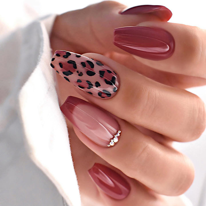 Artificial nail set with elegant animal print and glitter accents Bowlift