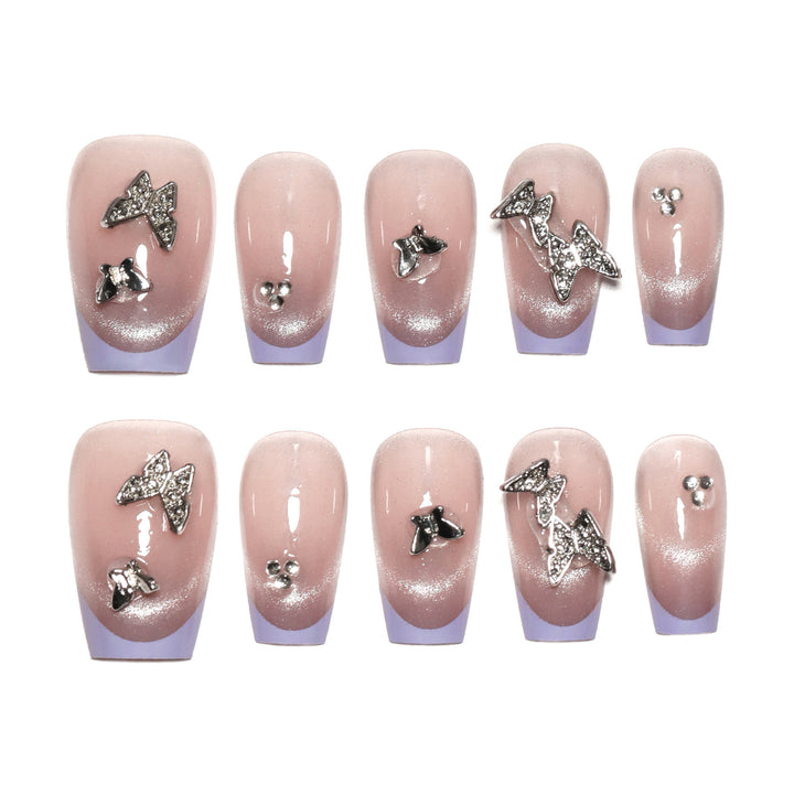 Artificial nail extensions with glitter design and elegant accents Bowlift