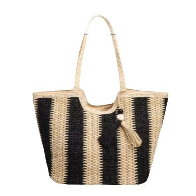 Beach bag with cheerful stripes and tassel details Bowlift