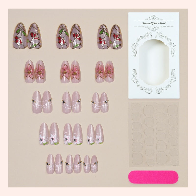Artificial nail set with luxurious floral designs and glitter accents Bowlift