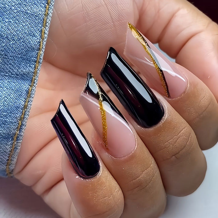 Elegant Stiletto Nail Enhancements with Golden Accents Bowlift