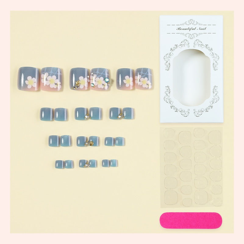 Artificial nail set with floral appliqués and glitter effects Bowlift