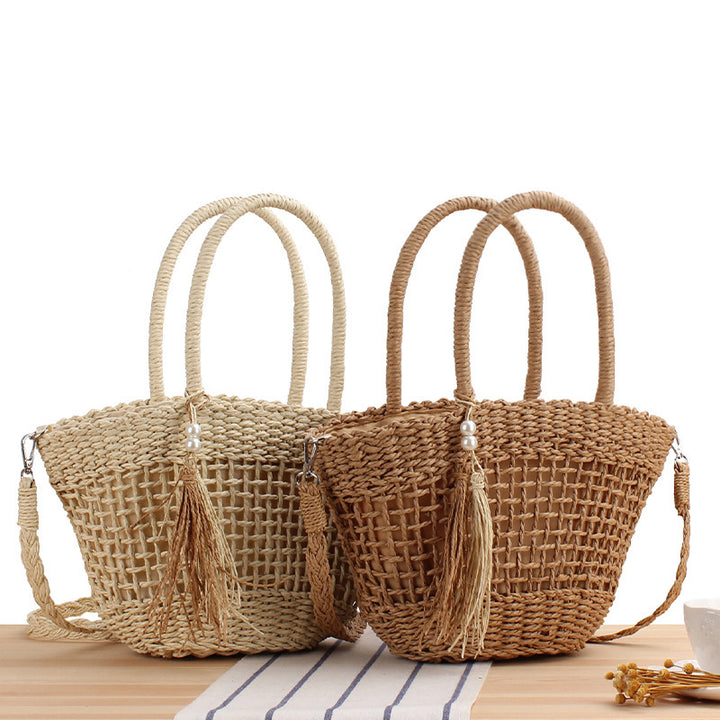 Handbag made of braided natural material with elegant tassel decoration Bowlift