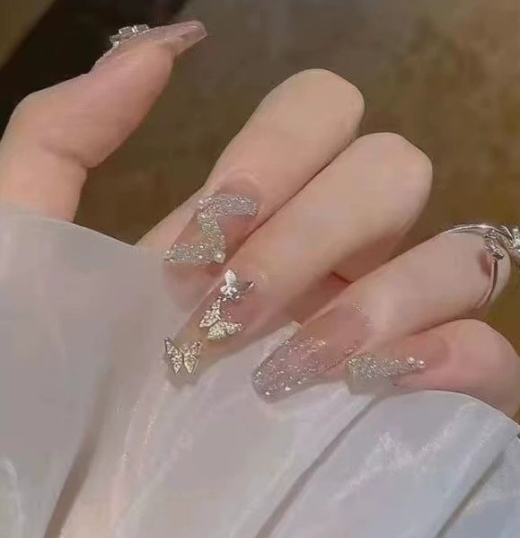 Elegant nail design with pearl embellishment Bowlift