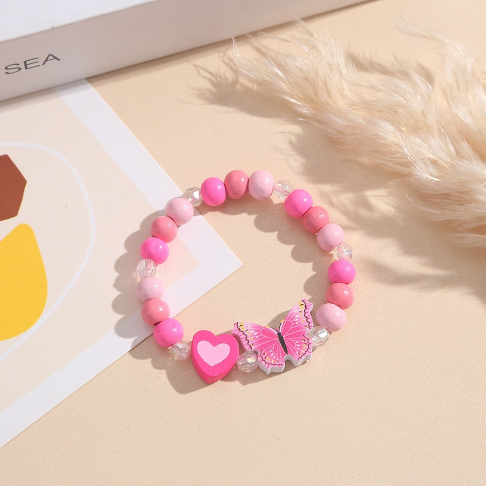 Playful bracelet with heart and butterfly charms Bowlift