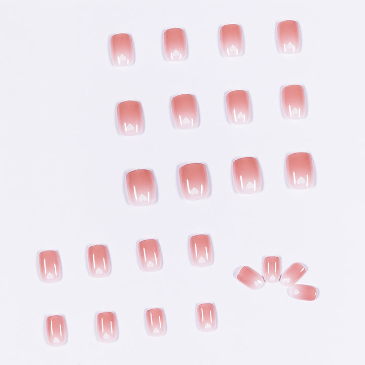 Artful nail art with heart-shaped accents and gentle ombre effect Bowlift