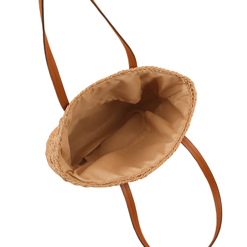 Handbag made of hand-woven natural material with sturdy leather handles Bowlift