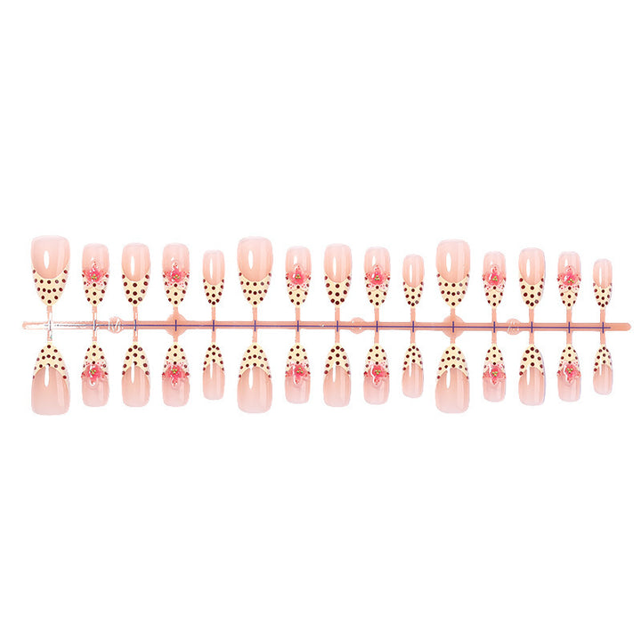 Acrylic nail set with romantic dots and floral accents Bowlift