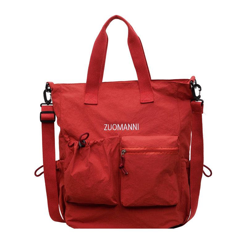 Tote bag with multifunctional outer pockets and adjustable shoulder strap Bowlift