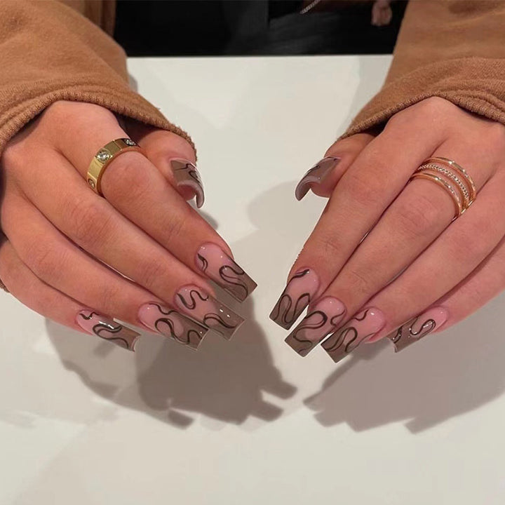 Artful Gel Nails with Elegant Floral Design and Glitter Accents Bowlift