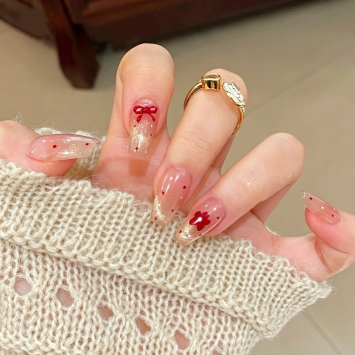 Artificial nails with sparkling accents and delicate patterns Bowlift
