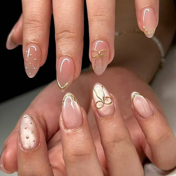 Artful nail extensions with elegant golden accents Bowlift