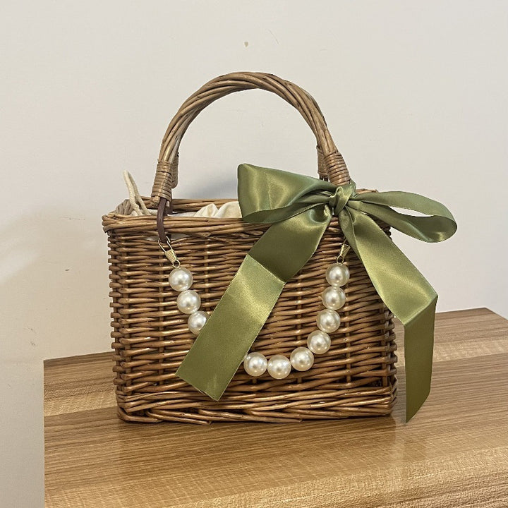 Ladies' basket bag with decorative pearl accents and bow decoration Bowlift