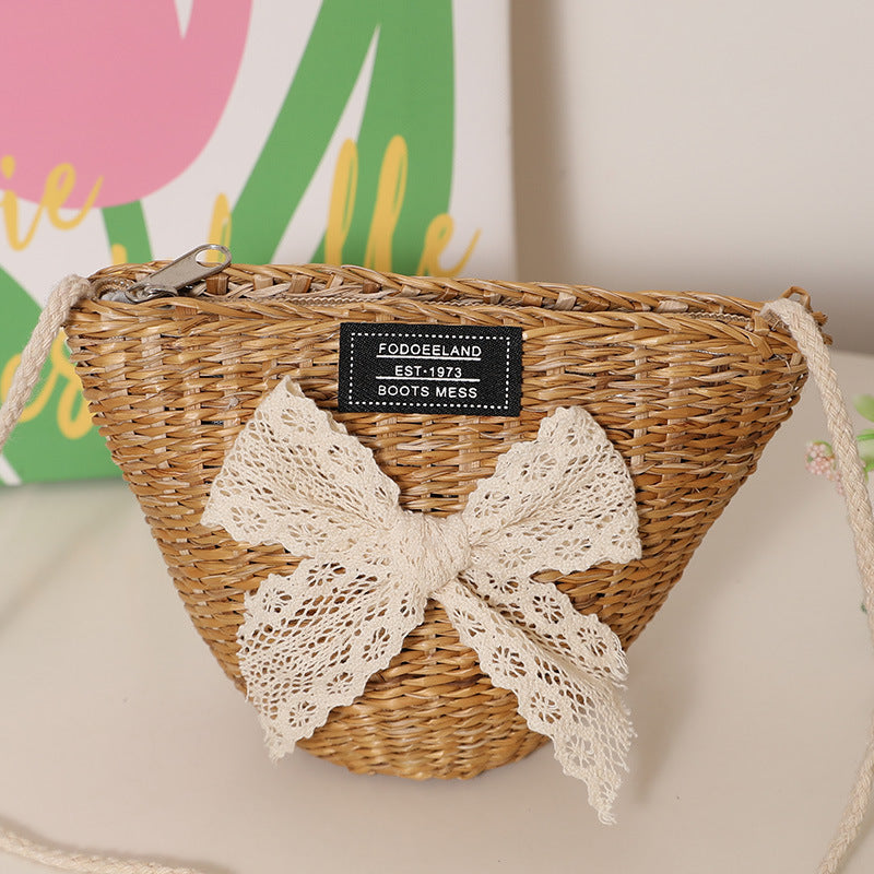 Playful straw shoulder bag with floral accents Bowlift