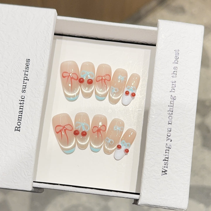 Artificial nail tips with romantic bow and cherry motifs Bowlift