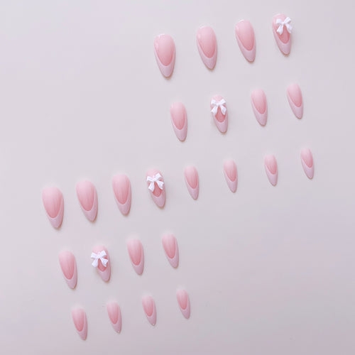 Artificial nail set with elegant tips and delicate bow decorations Bowlift
